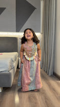 Girl laughing in pastel tassel lehenga set