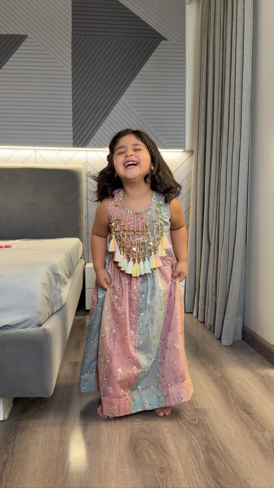 Girl laughing in pastel tassel lehenga set